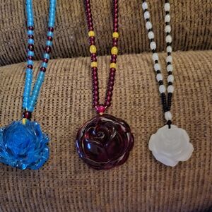 Red Ŵhite And Blue Beaded Necklaces with Floral Pendants.